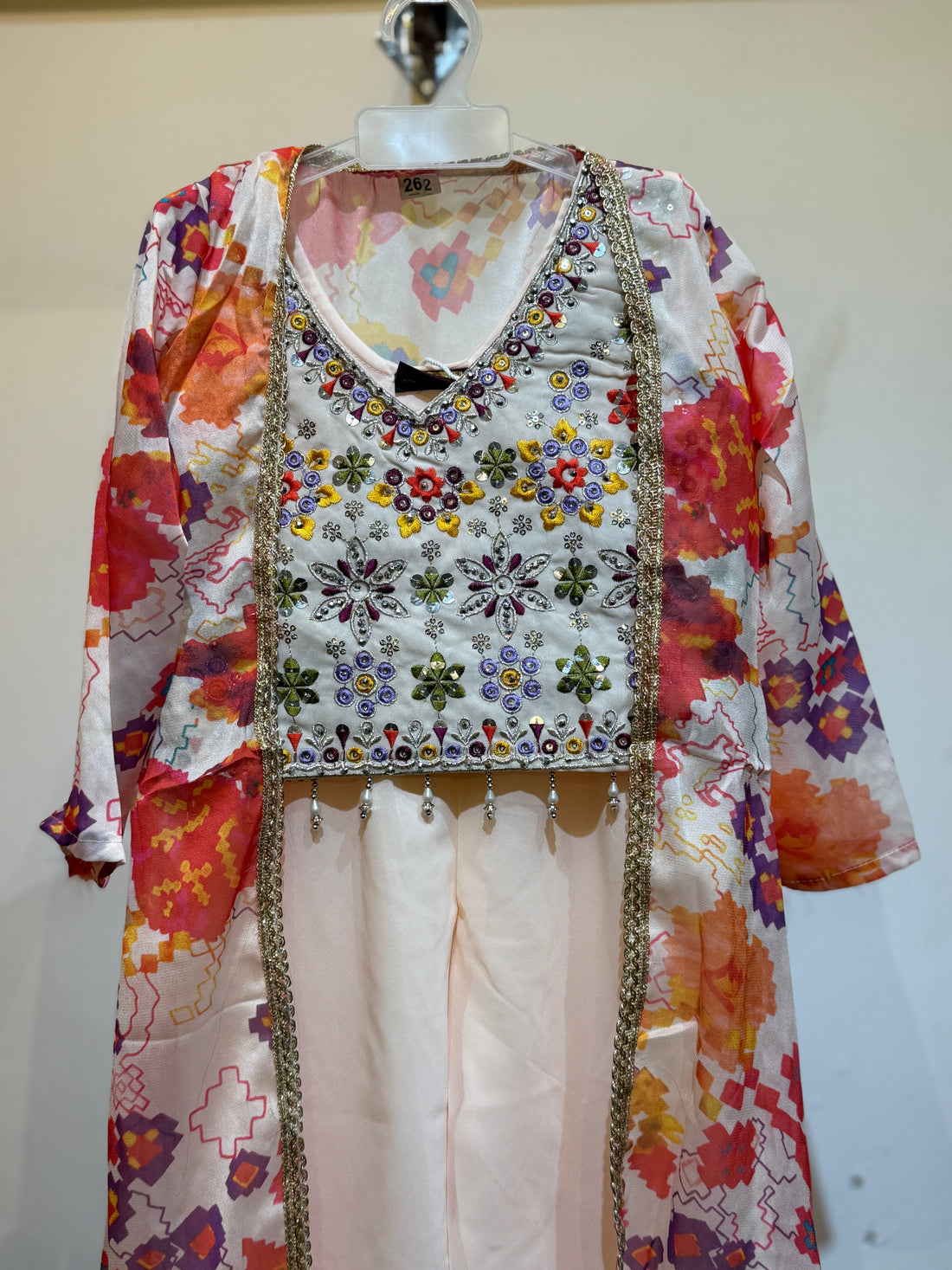 Festive designe Premium Peach palazzo set with orange floral long shrug