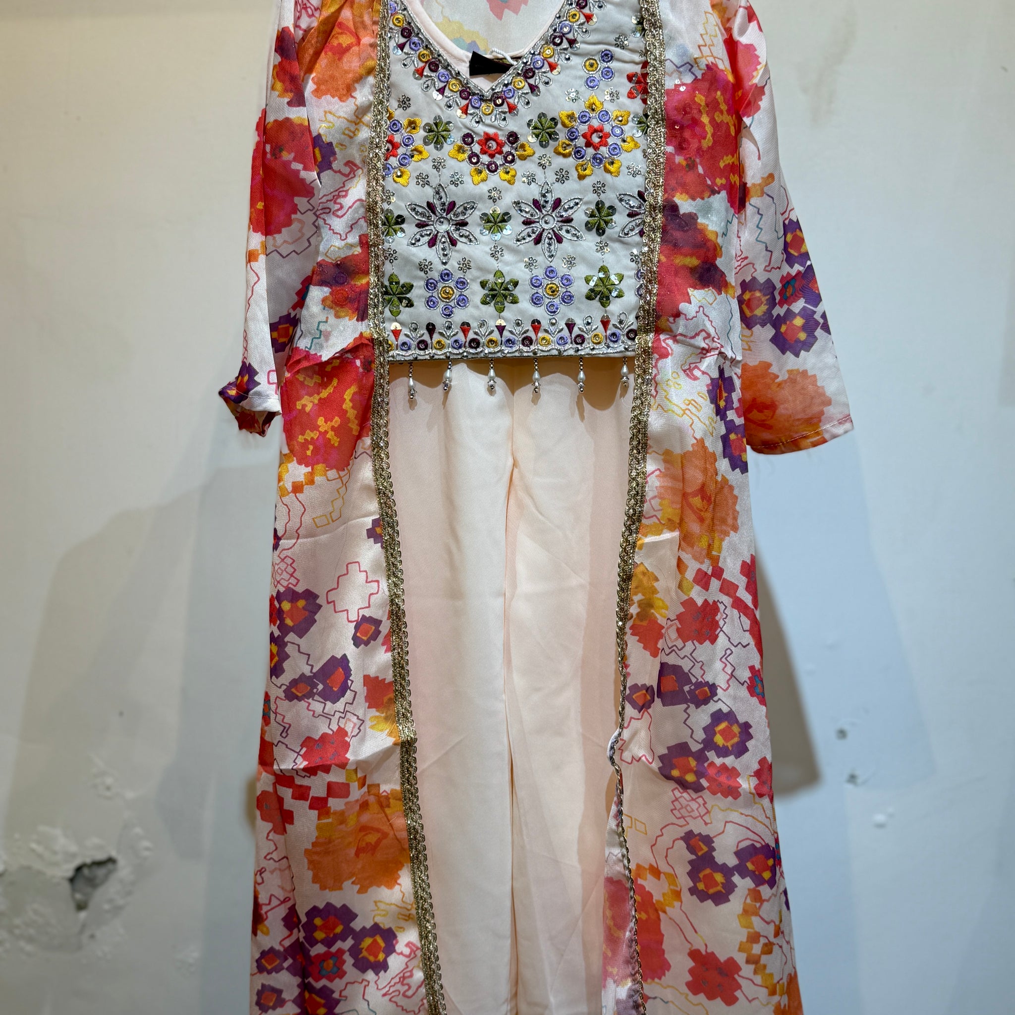 Festive designe Premium Peach palazzo set with orange floral long shrug