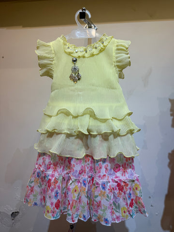 Yellow solid top with floral skirt