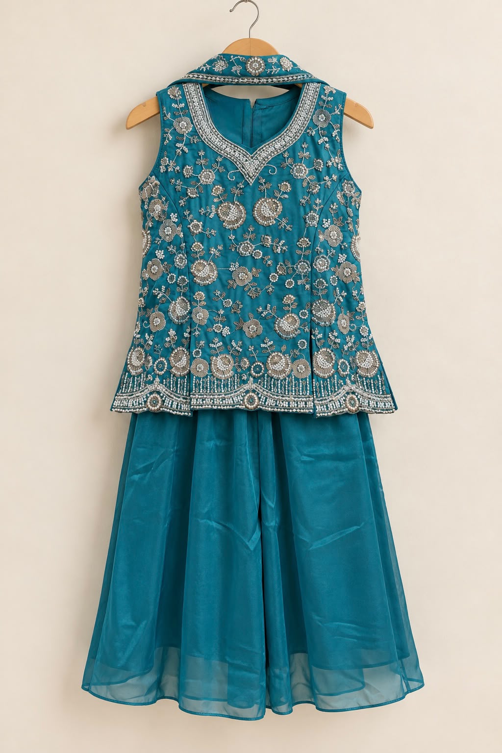 Teal blue top with heavy silver zari and pearl embroidered dupatta with palazzo